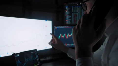 Trader speak on smartphone analyzing stock market Stock Footage 170751059