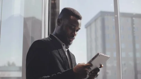 Trader using tablet in elevator Stock Footage 121151904