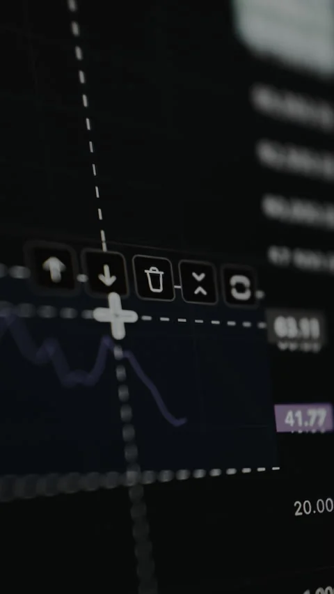Trader vies the technical analysis and price charts on a trading platform Stock Footage 328863157