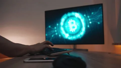 Trader working with computer on stockmarket trading floor, Bitcoin Stock Footage 147292877