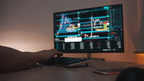 Trader working with computer on stockmarket trading floor Stock Footage 147292893