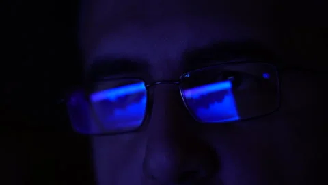 Trader works with a computer. Screen with stock charts and data analysis Stock Footage 262986002