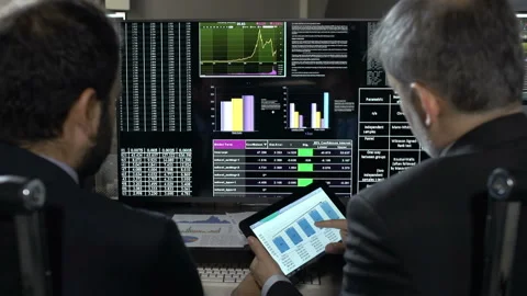 Traders Analysing Stock Market Data Stock Footage 210461547