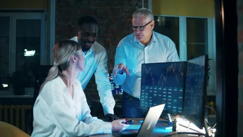 Traders are smiling while discussing the stock market rates Stock Footage 170422687