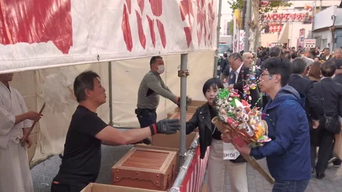 Traders bringing back to Tori-no-Ichi Fair their auspicious rakes of past year. Stock Footage 142245311