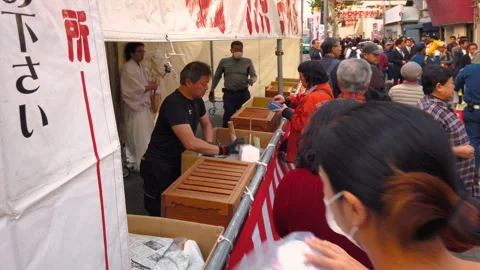 Traders bringing back to Tori-no-Ichi Fair their auspicious rakes of past year. Stock Footage 142245624
