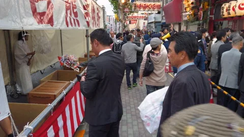 Traders bringing back to Tori-no-Ichi Fair their auspicious rakes of past year. Stock Footage 142245638