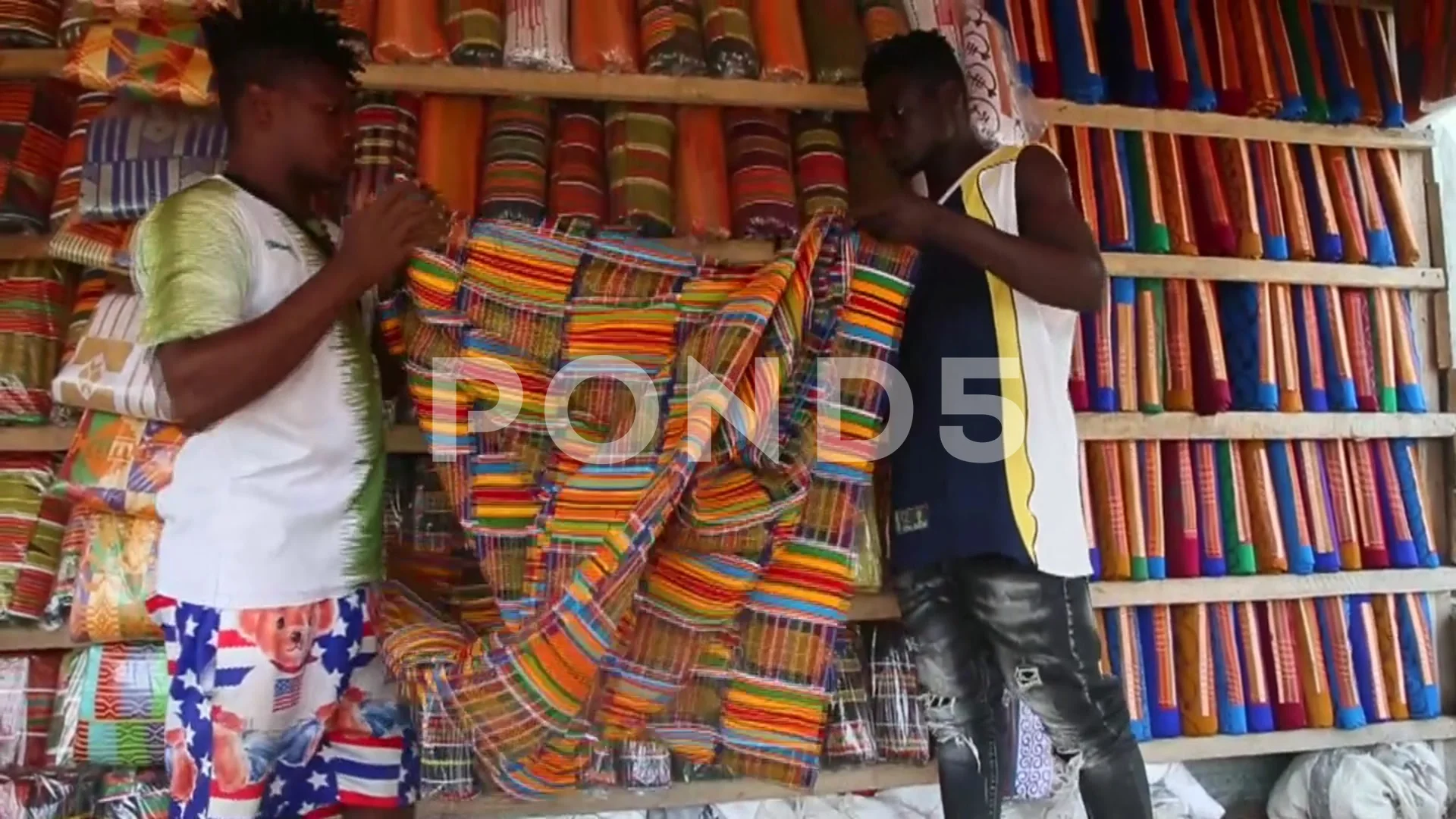 Traders sell traditional Akan clothing, , Stock Video