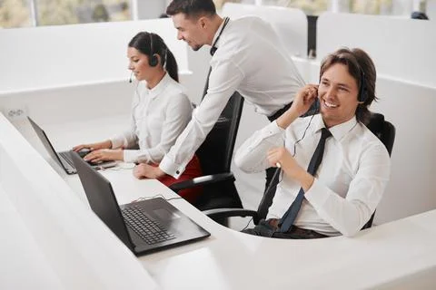 Traders working in modern office together Stock Photos