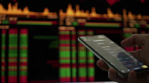 Trading cryptocurrency on smartphone device Stock Footage 167655709
