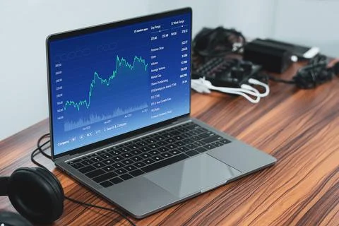 Trading online digital graph chart in computer technology at home , Trader .. Stock Photos