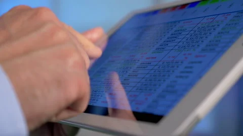 Trading Stocks on Tablet 4k Stock Footage 162357294
