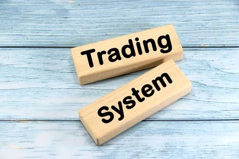 Trading System wording  or text on wood block with blue background.Copy spa.. Stock Photos