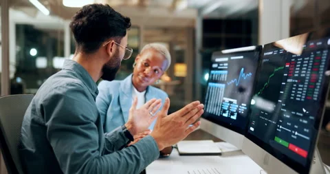 Trading, tablet and team advice on computer screen in office for market timing Video stock 336310103