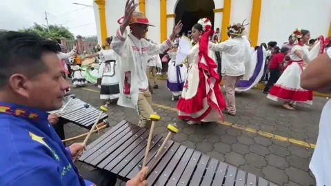 Tradition of "Los Chinegros": Devotion and whipping in San Juan de Oriente, Nica Stock-Footage 311900652