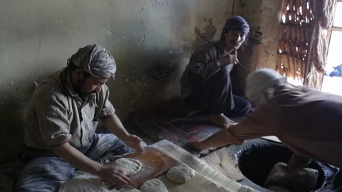 Traditional Afghan Bakers are preparing bread Stock Footage 100375660