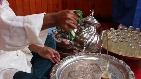 Traditional and ritual preparation of mint tea in Morocco by an old berber - 5 Stock Footage