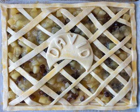 Traditional apple pie, cross pattern with David's name in the middle before.. Stock Photos