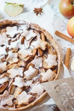 Traditional apple pie on the table with decorations. Stock Photos