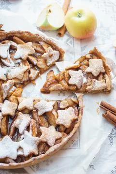 Traditional apple pie on the table with decorations. Stock Photos