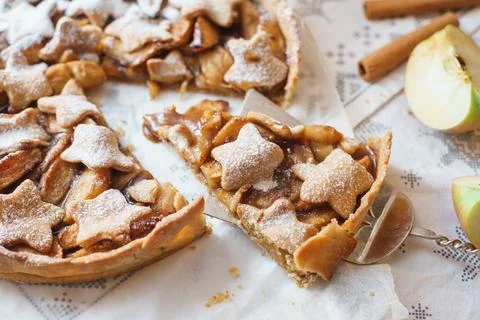 Traditional apple pie on the table with decorations. Stock Photos