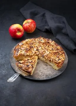 Traditional apple pie torta di mele cremosa with almond flakes served as clos Stock Photos