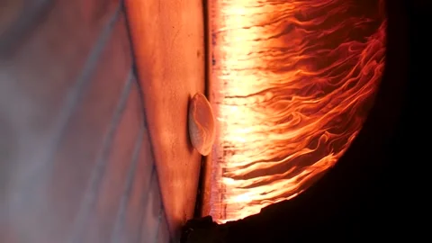 Traditional Arabic bread quickly baking inside a fire oven. Stock Footage 200775766