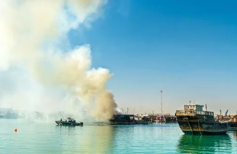 Traditional arabic dhow on fire in Doha, Qatar Fotos de archivo