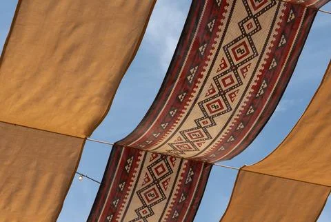 Traditional Arabic Patterned Fabric Canopy under Clear Blue Sky at Mina Dis.. Stock Photos