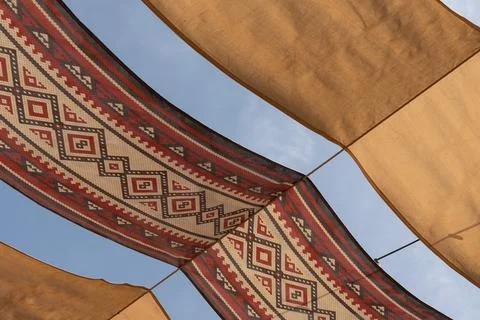 Traditional Arabic Patterned Fabric Canopy under Clear Blue Sky at Mina Dis.. Stock Photos