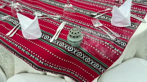 Traditional Arabic table setting with red patterned cloth and Ramadan lantern Stock Footage 329596539