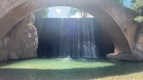 Traditional arched stone bridge, cascade waterfall Paleokarya Trikala Greece Stock Footage 339806135