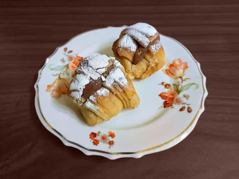 Traditional Argentine facturas (sweet bakery) filled with dulce de leche (mil Stock Photos