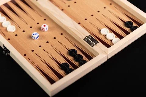  Traditional backgammon game. Board with backgammon game pieces on black b... Stock Photos