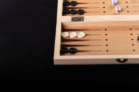  Traditional backgammon game. Board with backgammon game pieces on black b... Stock Photos
