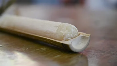 Traditional Bamboo Rice Served in a Split Bamboo Tube Video stock 342068510