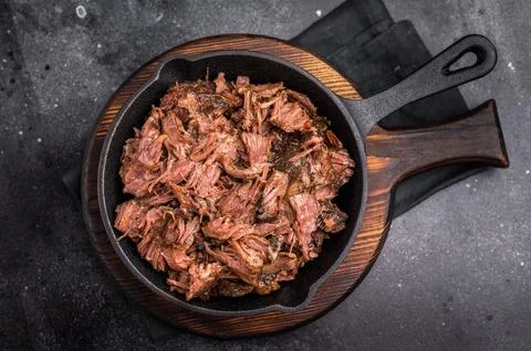 Traditional barbecue pulled beef, Slow cooked meat cooked in a smoker. blac.. Stock Photos