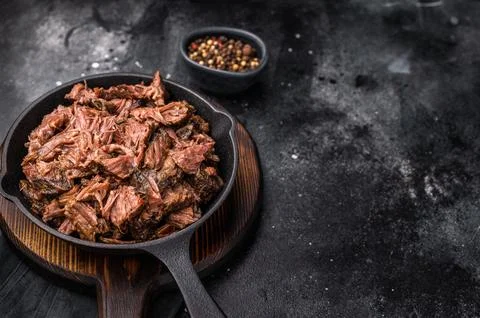 Traditional barbecue pulled beef, Slow cooked meat cooked in a smoker. blac.. Stock Photos