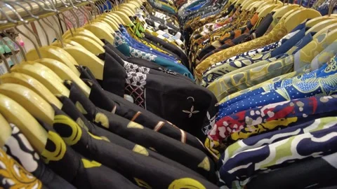 Traditional Batik Clothing Display in a Modern Retail Store Stock Footage 345960862