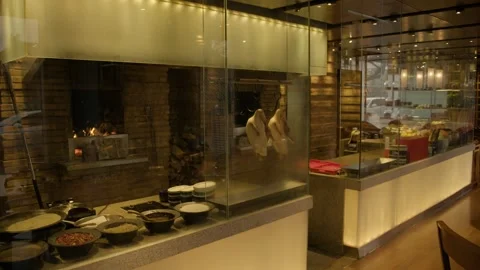 Traditional Beijing Restaurant Kitchen with Hanging Poultry and Open Fire Oven Stock Footage 345776930
