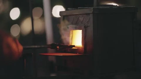Traditional Blacksmith Forging Hot Metal in Furnace Stock Footage 339751501