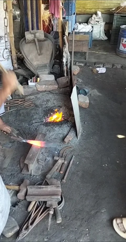 Traditional Blacksmith Forging a Metal Tool on an Anvil. Stock Footage 323540171
