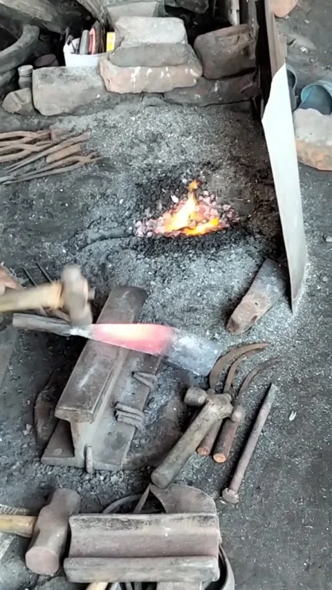 Traditional Blacksmith Forging a Metal Tool on an Anvil. Stock Footage 323540175
