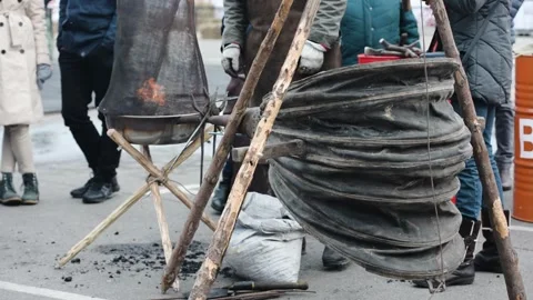 Traditional Blacksmith Working with Ancient Forge and Leather Bellows Outdoors Video stock 346130662
