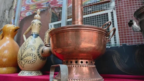 Traditional Brass Hot Pot Cookware Displayed Outside a Shop in Kashgar Stock Footage 343487935