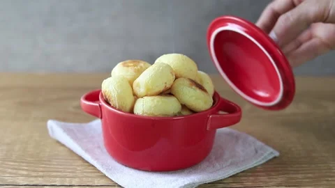 Traditional Brazilian snack cheese breads being served Stock Footage 139727559