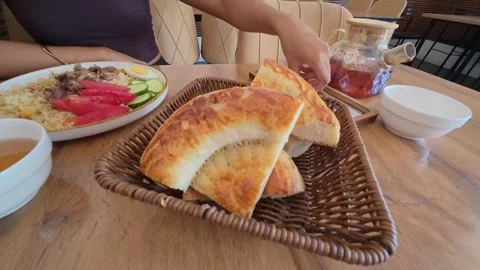 Traditional bread basket on a restaurant table, Kyrgyzstan Stock Footage 347242539
