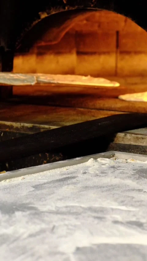 Traditional bread making in stone oven Stock-Footage 228065711