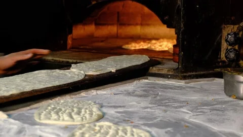 Traditional bread making in stone oven Stock Footage 228070104