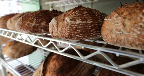 Traditional breads stacked together on shelf at bakery3 Stock Footage 118664402